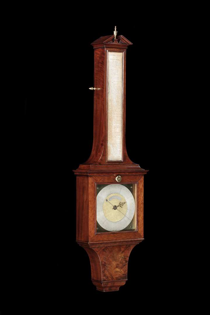 A mahogany wheel barometer